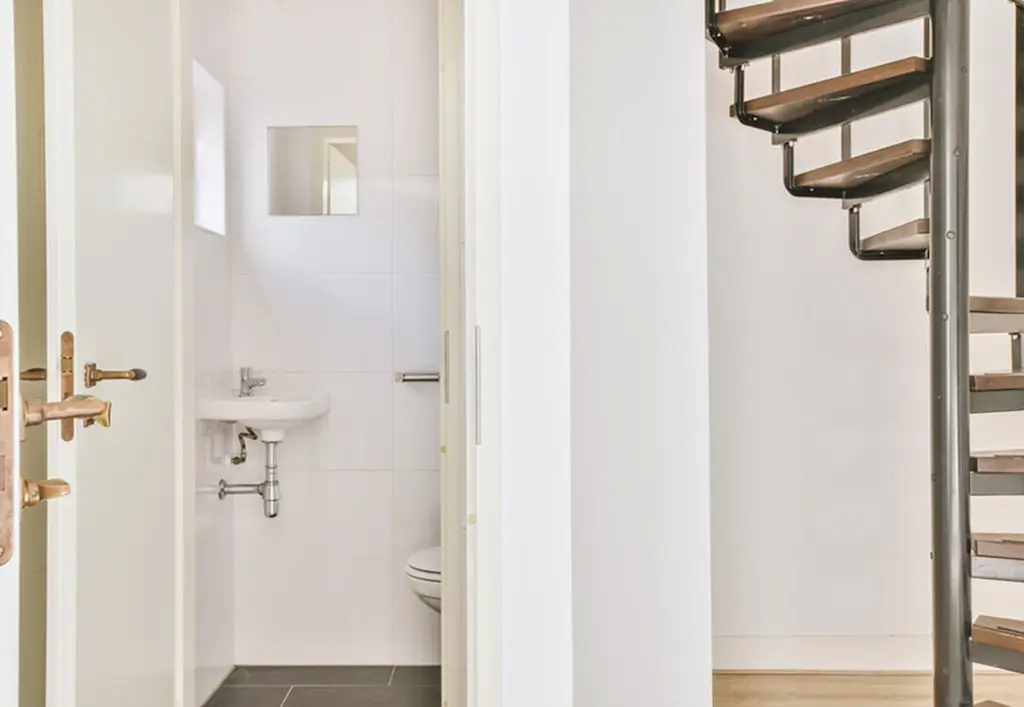Small downstairs toilet under stairs