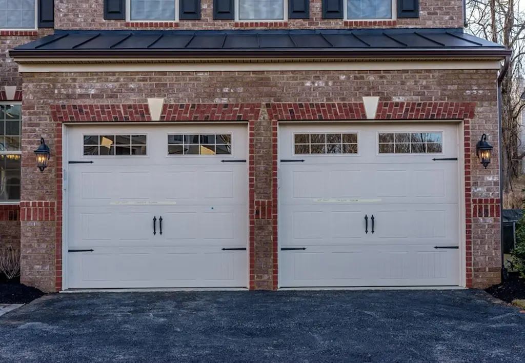 Newly built brick garage side hinged doors
