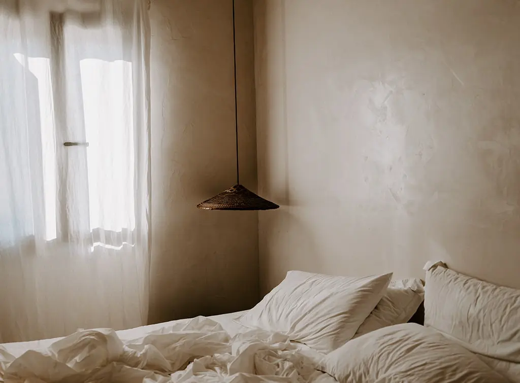 limewash wall effect in bedroom
