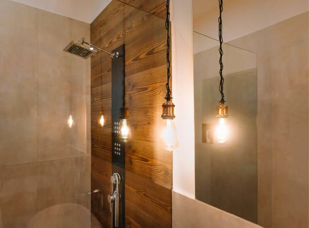 Industrial hanging lights in modern bathroom