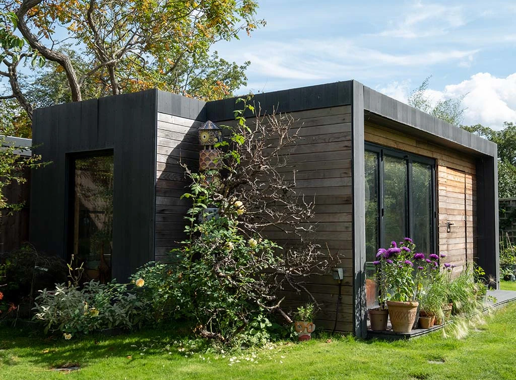 Garden office with black and timber cladding