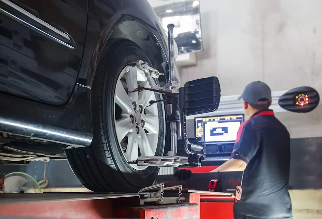 Automated wheel alignment in garage