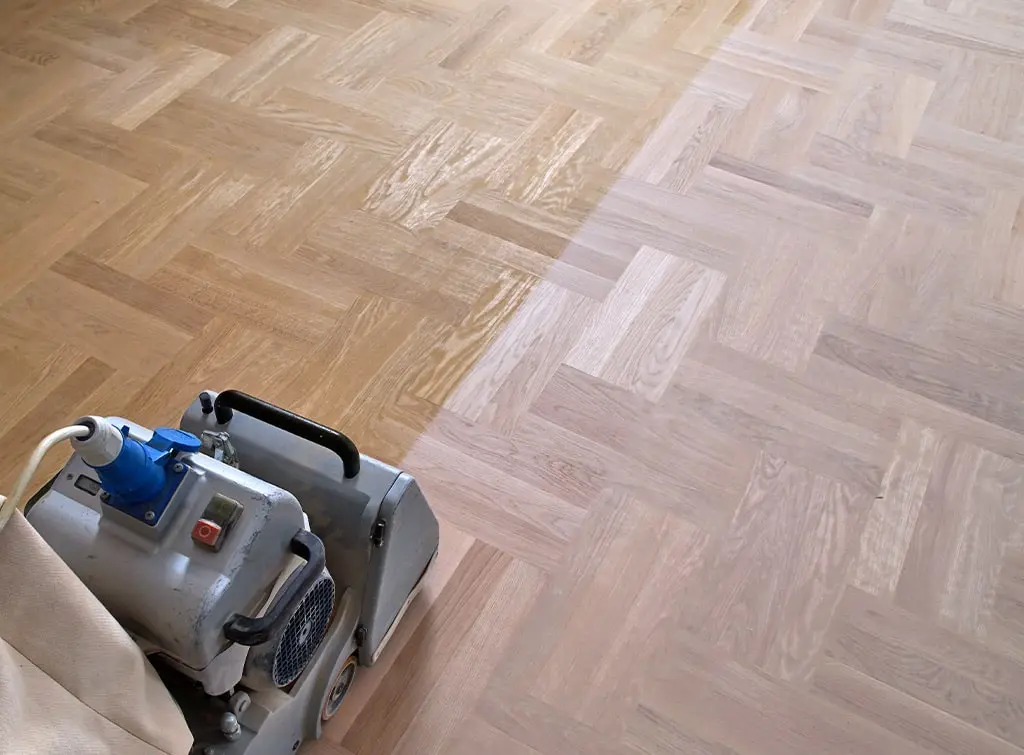 Hardwood floor being sanded and restored