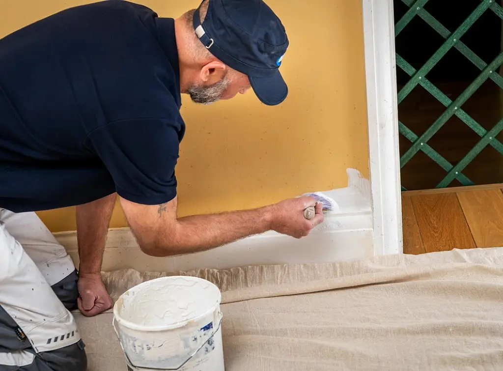 https://www.checkatrade.com/blog/wp-content/uploads/2023/12/handyman-painting-job.jpg