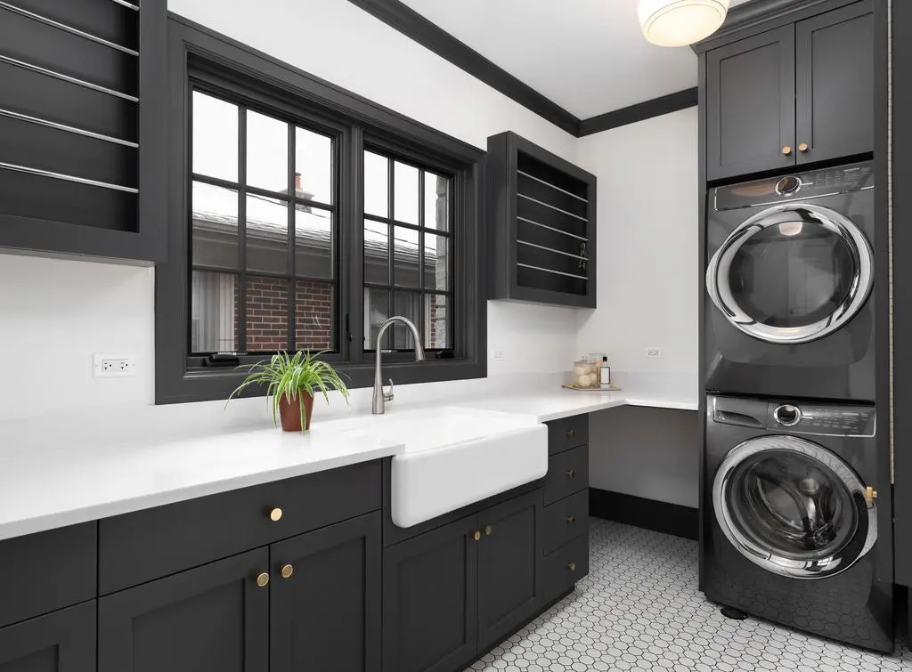 dark-grey-laundry-room-belfast-sink-stacked-appliances