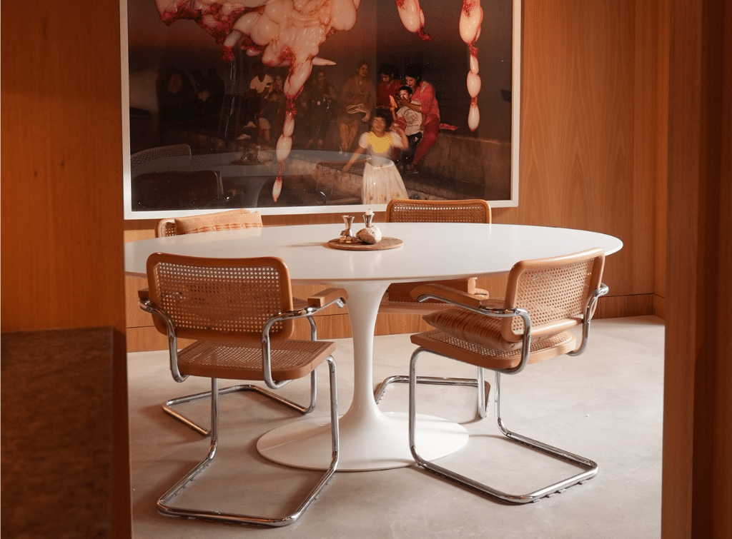 The Eero Saarinen Tulip Table paired with classic cantilever chairs are synonymous with midcentury modern decor