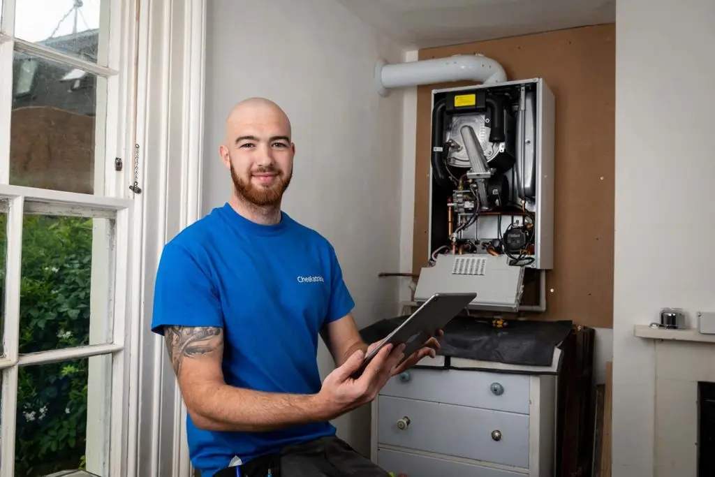 Checkatrade tradesperson servicing a boiler