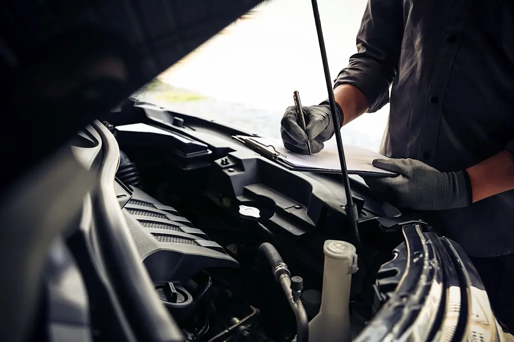 mechanic checking engine