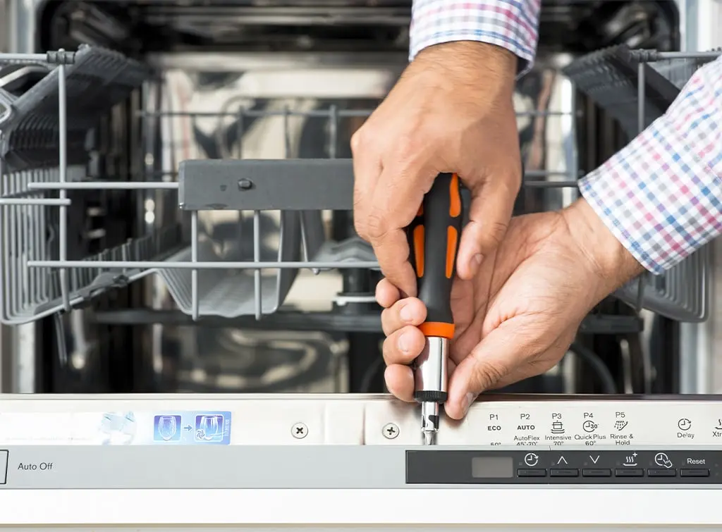 https://www.checkatrade.com/blog/wp-content/uploads/2024/08/How-much-does-an-appliance-repair-technician-earn-screwdriver.jpg