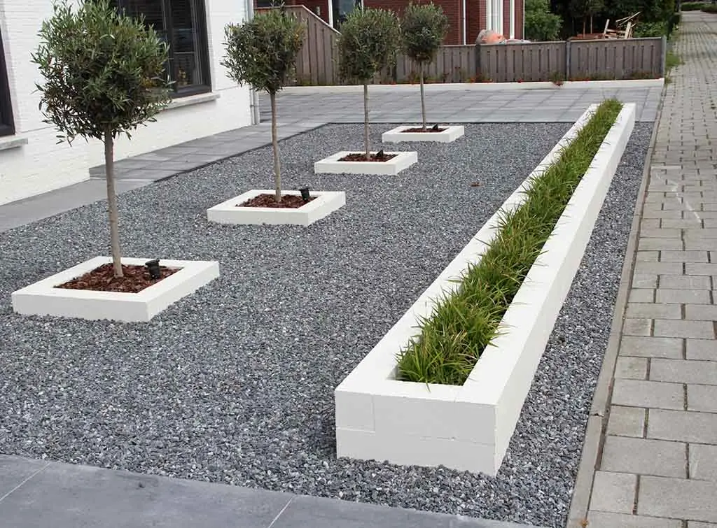 gravel driveway with bushes