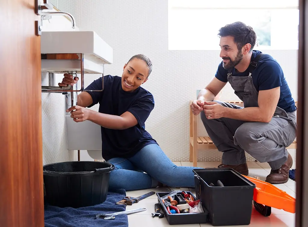 https://www.checkatrade.com/blog/wp-content/uploads/2024/02/how-many-women-are-plumbers.jpg