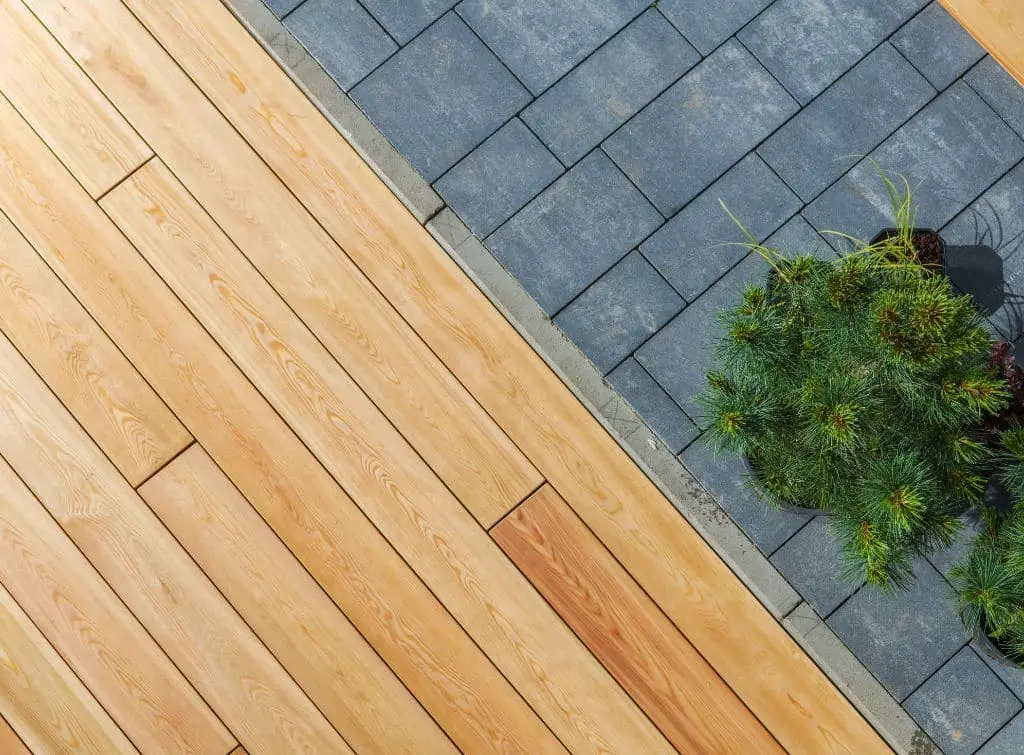 Verandah flooring ideas for Checkatrade blog - stone tiles and wooden boards side by side