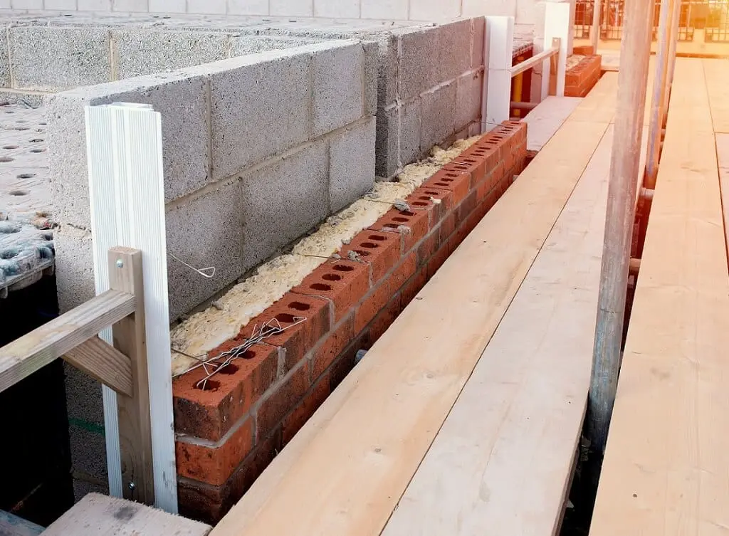 https://www.checkatrade.com/blog/wp-content/uploads/2024/11/adding-insulation-1.jpeg