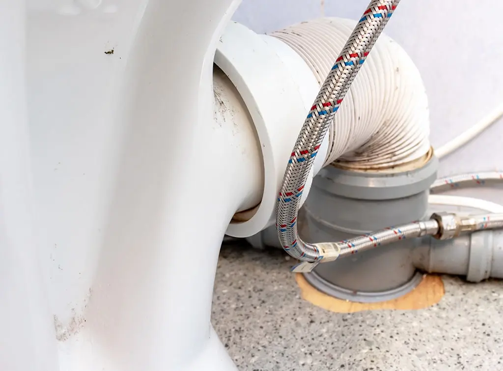 https://www.checkatrade.com/blog/wp-content/uploads/2023/08/why-is-my-toilet-pan-connector-leaking.jpg