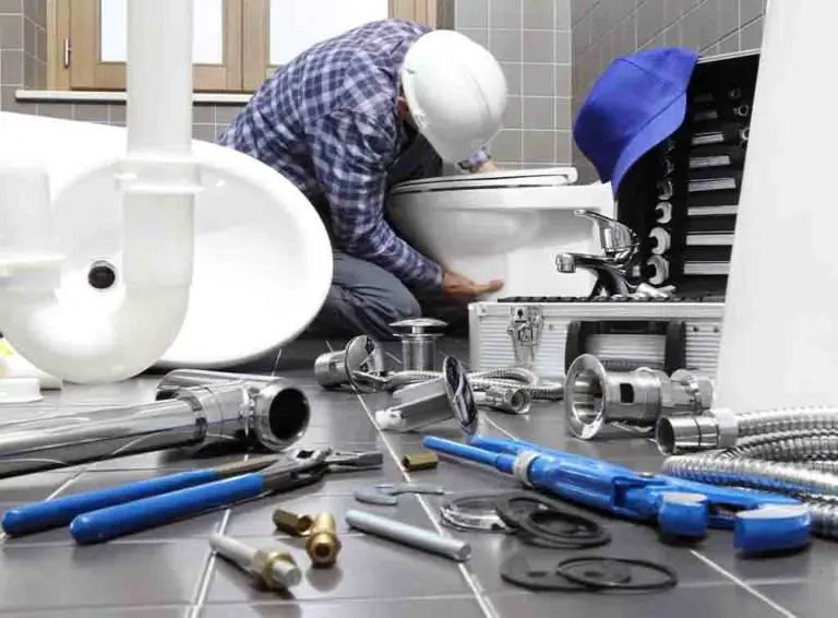 A toilet being installed