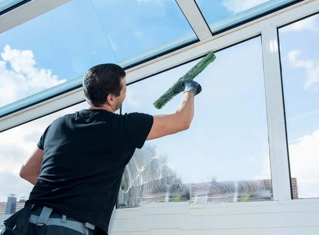 https://www.checkatrade.com/blog/wp-content/uploads/2024/08/window-cleaning-businessman-in-conservatory-1024x754.jpeg