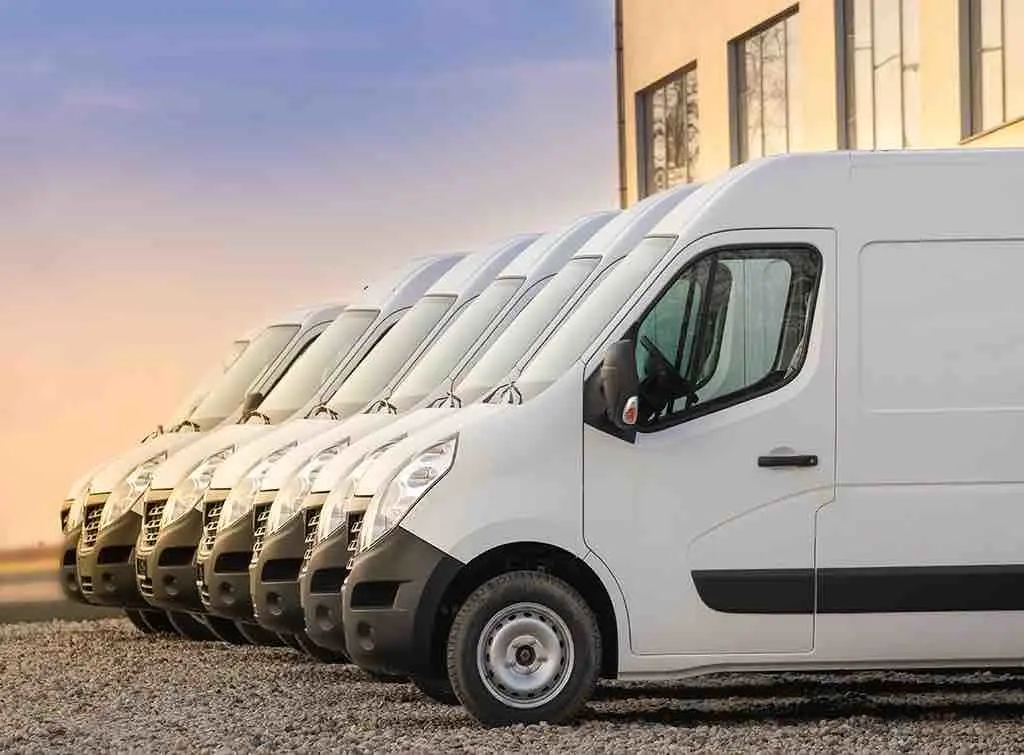 A row of white transit vans