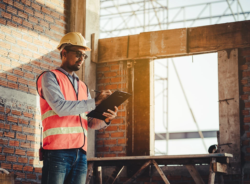 A worker checking a builder