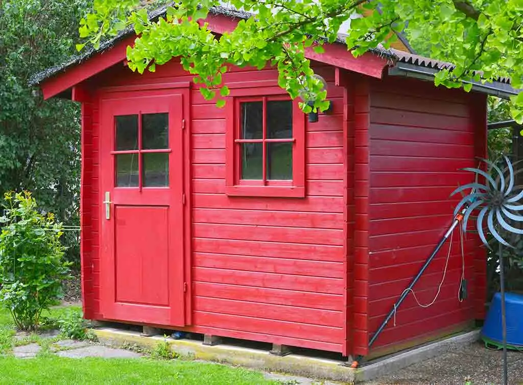 Red shed in simple garden