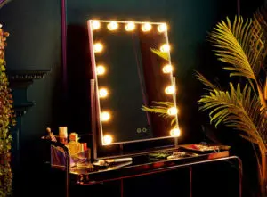 Hollywood style desk mirror with bulbs around the frame