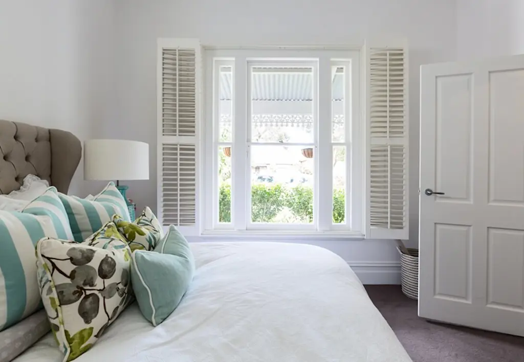 Window shutters in bedroom