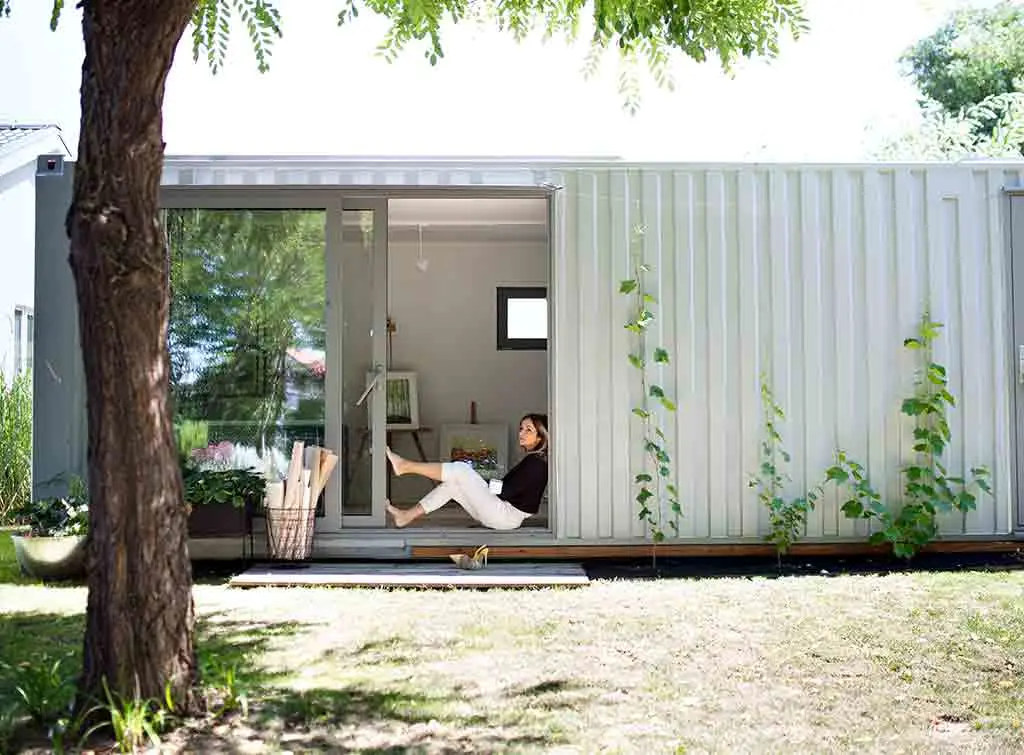 Woman sat in metal clad garden room