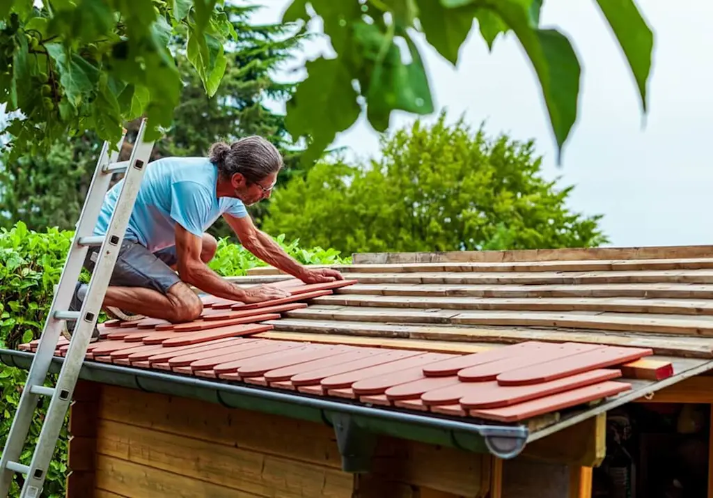 Putting new tile roof on shed