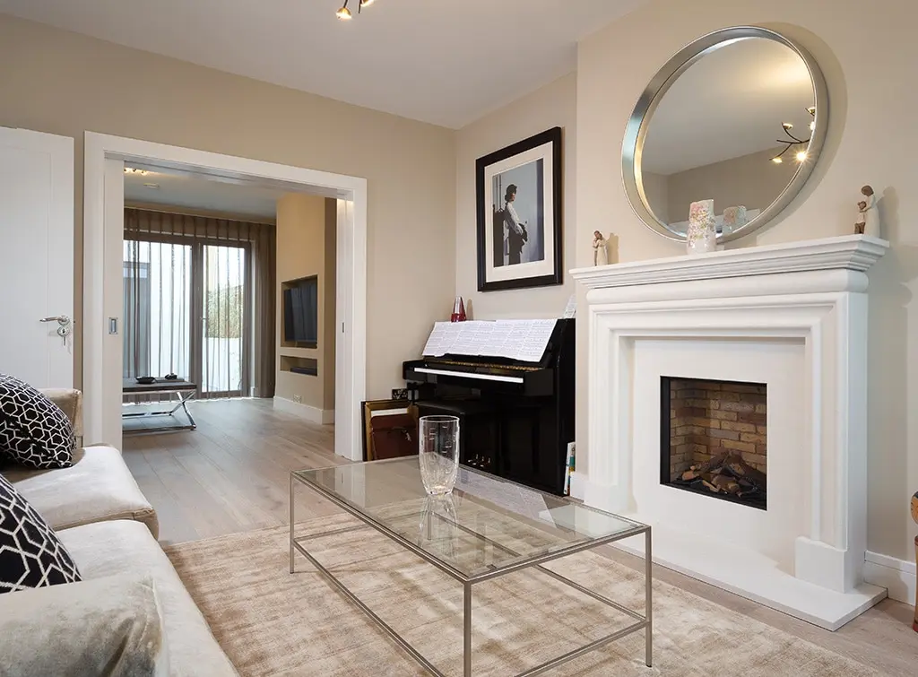 A black piano in an alcove in the lounge