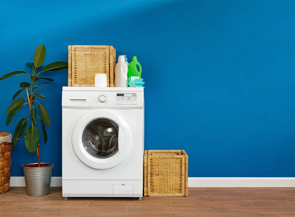 washing machine in blue utility room