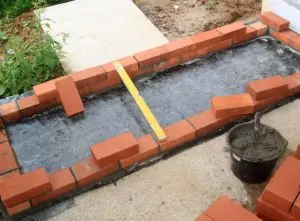 Base layer of a brick BBQ