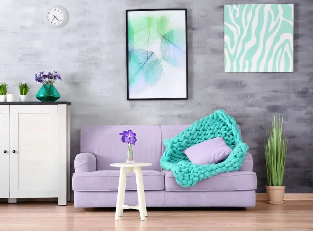 Boho meets industrial style interiors with turquoise and lilac accents and concrete walls