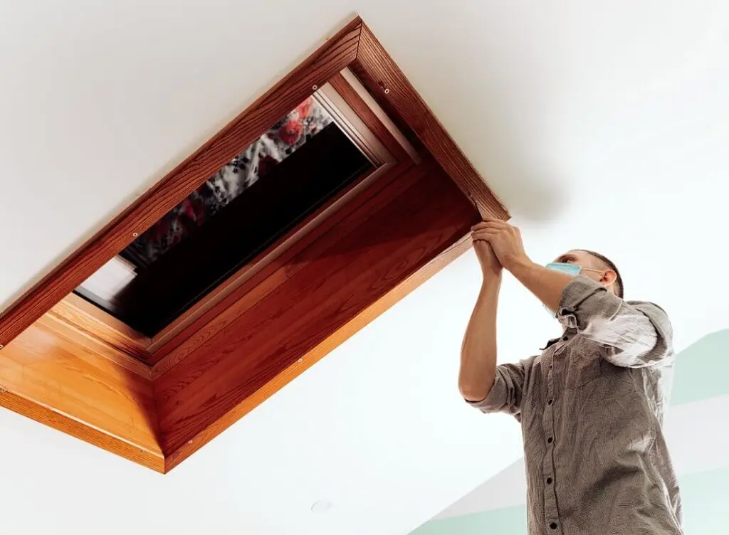https://www.checkatrade.com/blog/wp-content/uploads/2025/02/checking-installation-of-skylight-roof-window-1024x752.jpeg