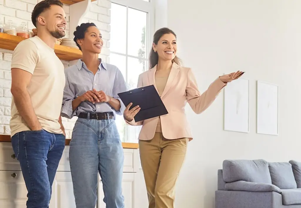 Estate agent showing couple