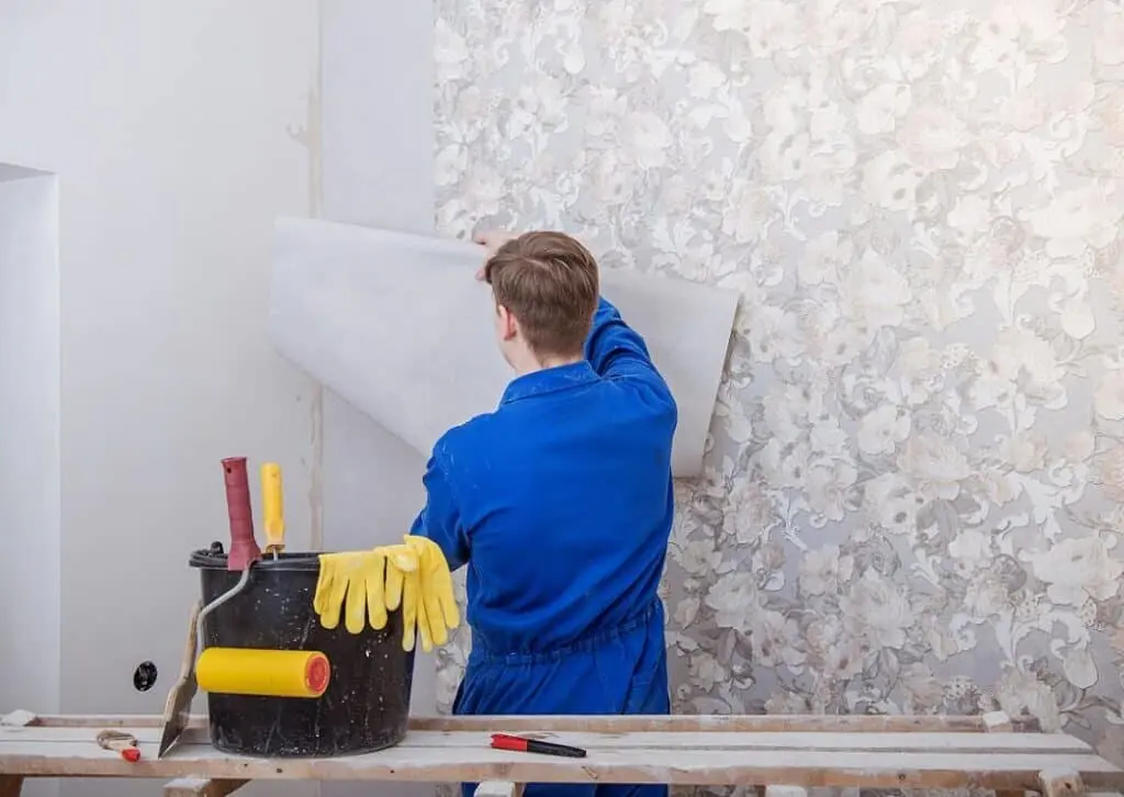 Trade applying wallpaper in a home