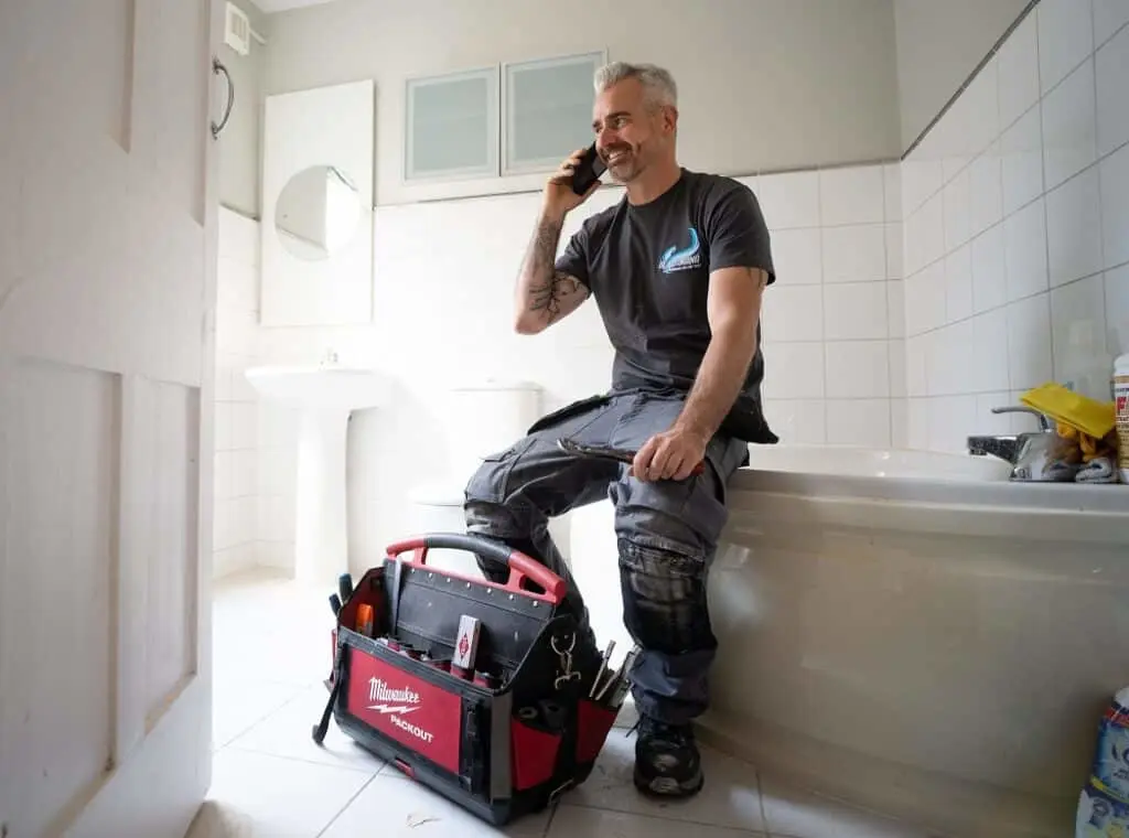 https://www.checkatrade.com/blog/wp-content/uploads/2023/10/plumber-workwear-1024x760.jpg
