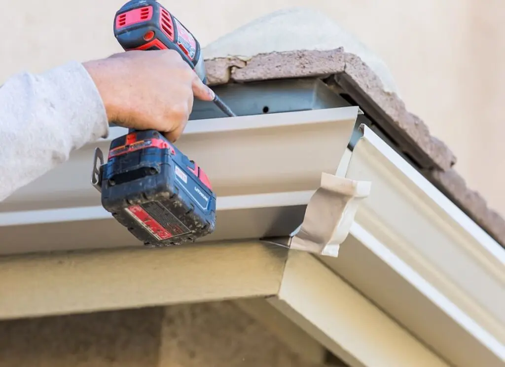 https://www.checkatrade.com/blog/wp-content/uploads/2025/03/installing-a-seamless-gutter-1024x743.jpeg