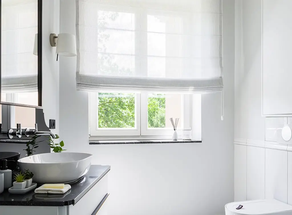 sheer roman blind in small bathroom