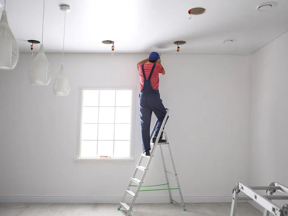 Electrician stretch ceiling installation