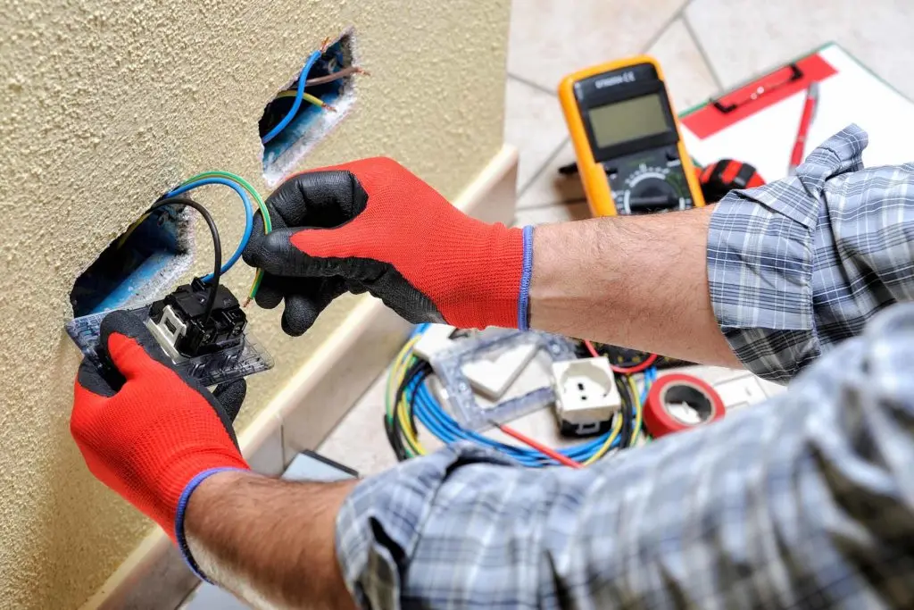 Electrician updating sockets for landlord