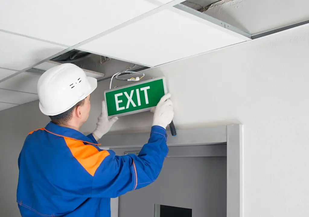 Fire escape signage being installed