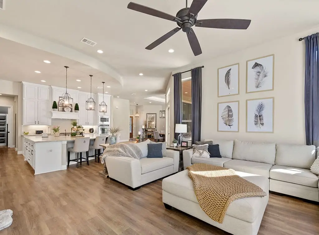 wood flooring in an open plan living room kitchen diner