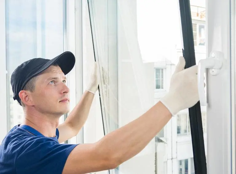 Professional installing triple glazed uPVC window