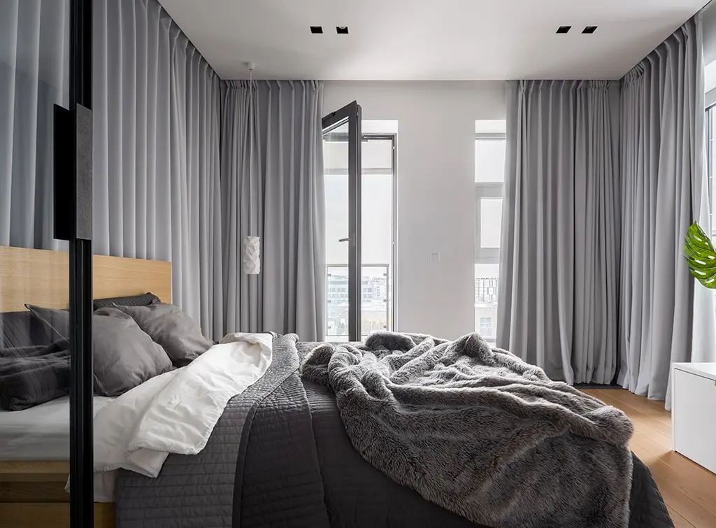 bedroom surrounded with curtains