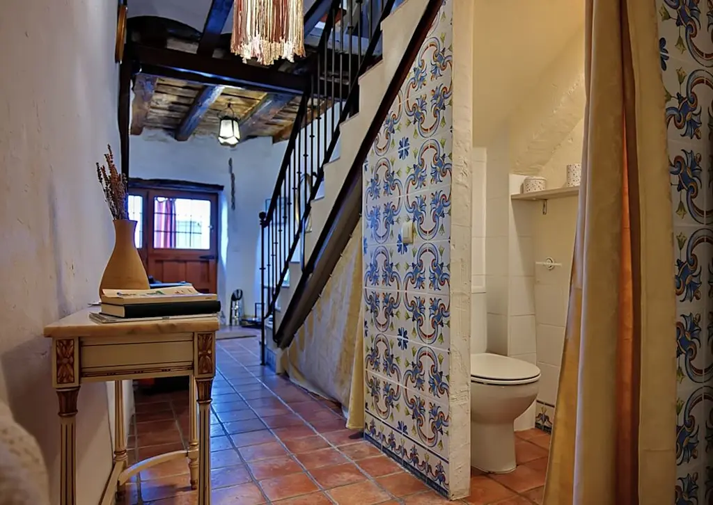 Toilet under the stairs