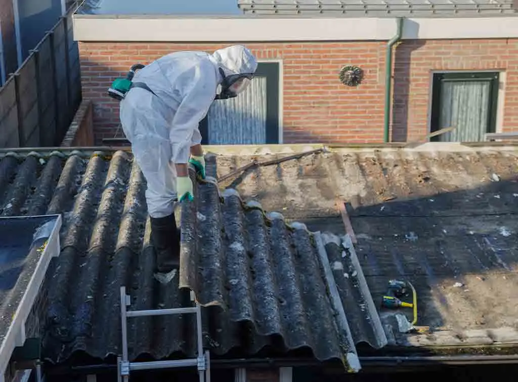 Asbestos roofing being removed