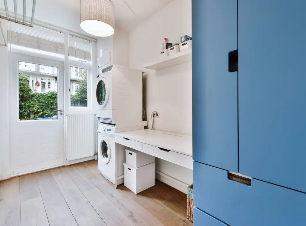utility-room-stacked-washer-dryer-blue-cupboards