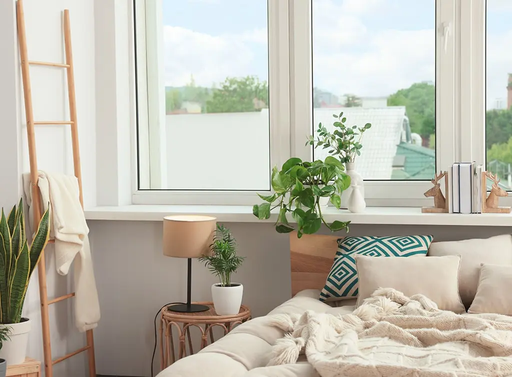 neutral bedroom with plants