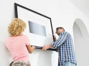 Couple hanging a photo