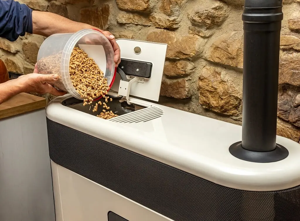 https://www.checkatrade.com/blog/wp-content/uploads/2024/12/biomass-fuel-burner-in-the-home.jpeg
