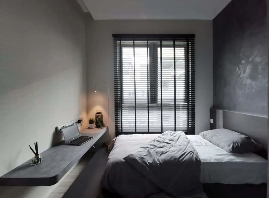 https://www.checkatrade.com/blog/wp-content/uploads/2024/02/Small-bedroom-with-charcoal-floating-shelf.jpg